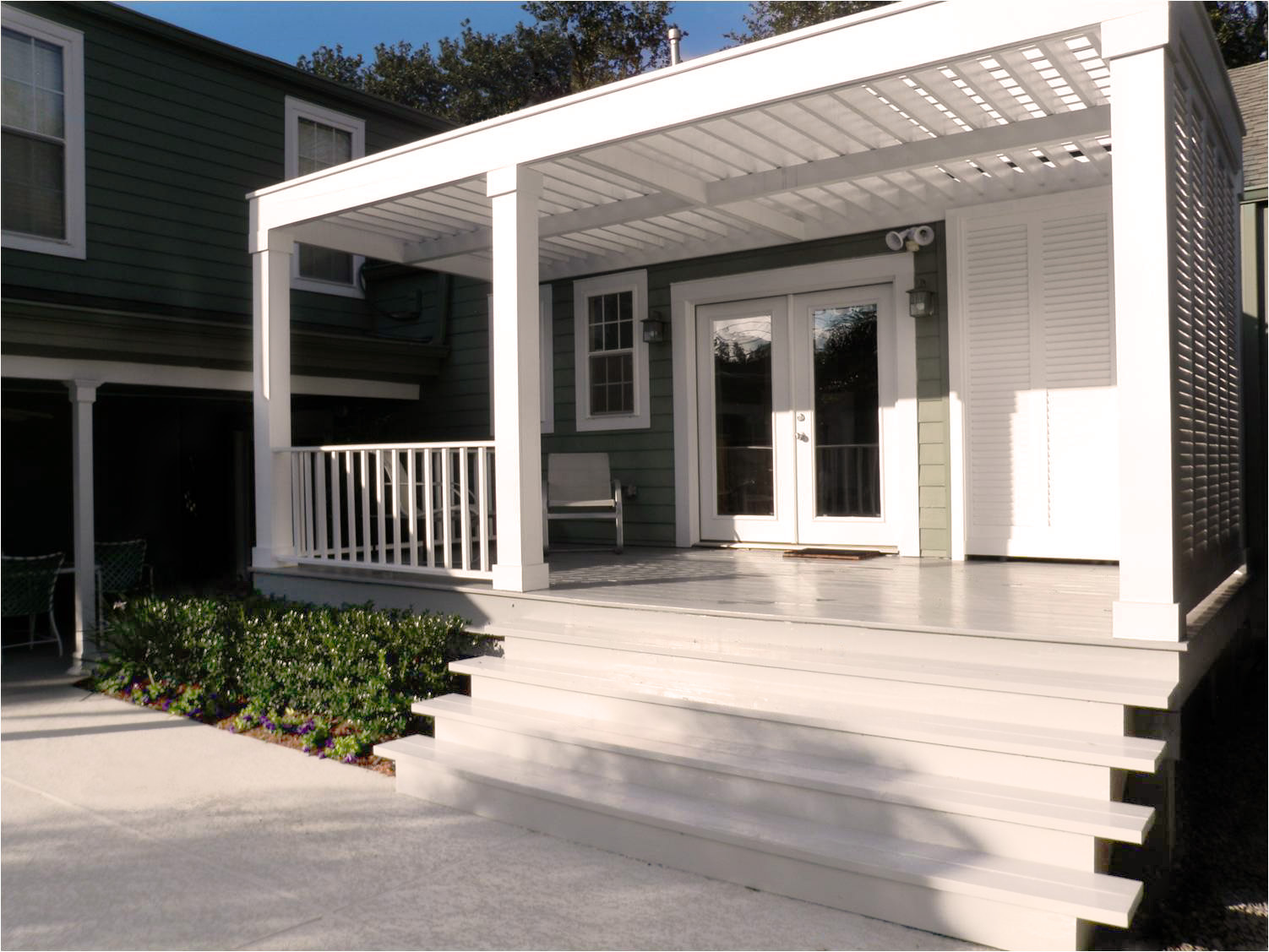 modern pergola shades porch on new orleans home