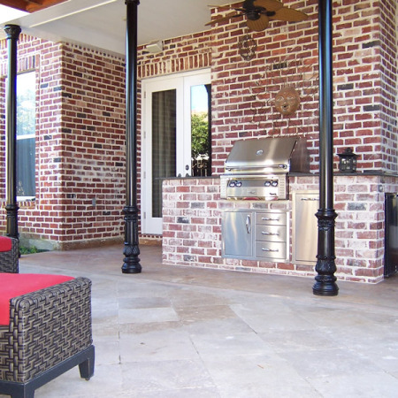 outdoor kitchen with brick and iron details